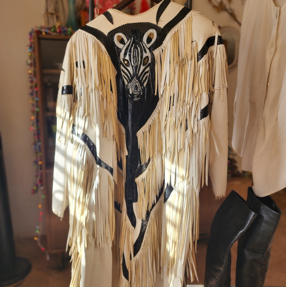 Sellerof leather fringe jacket